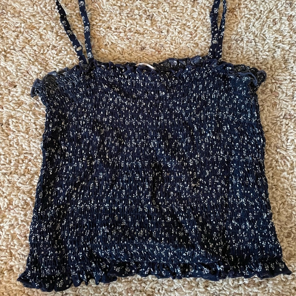 Navy blue tank from Pacsun with a white floral detail🤍